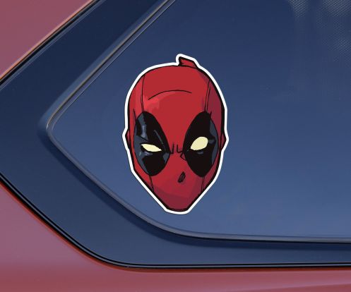 Sticker featuring the Marvel character Deadpool on a passenger side window of a car